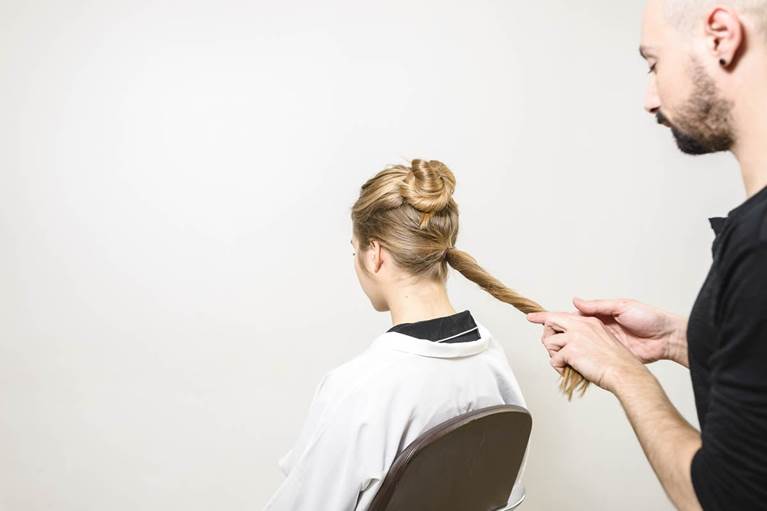 Three steps to this party hairstyle: A double volume topknot